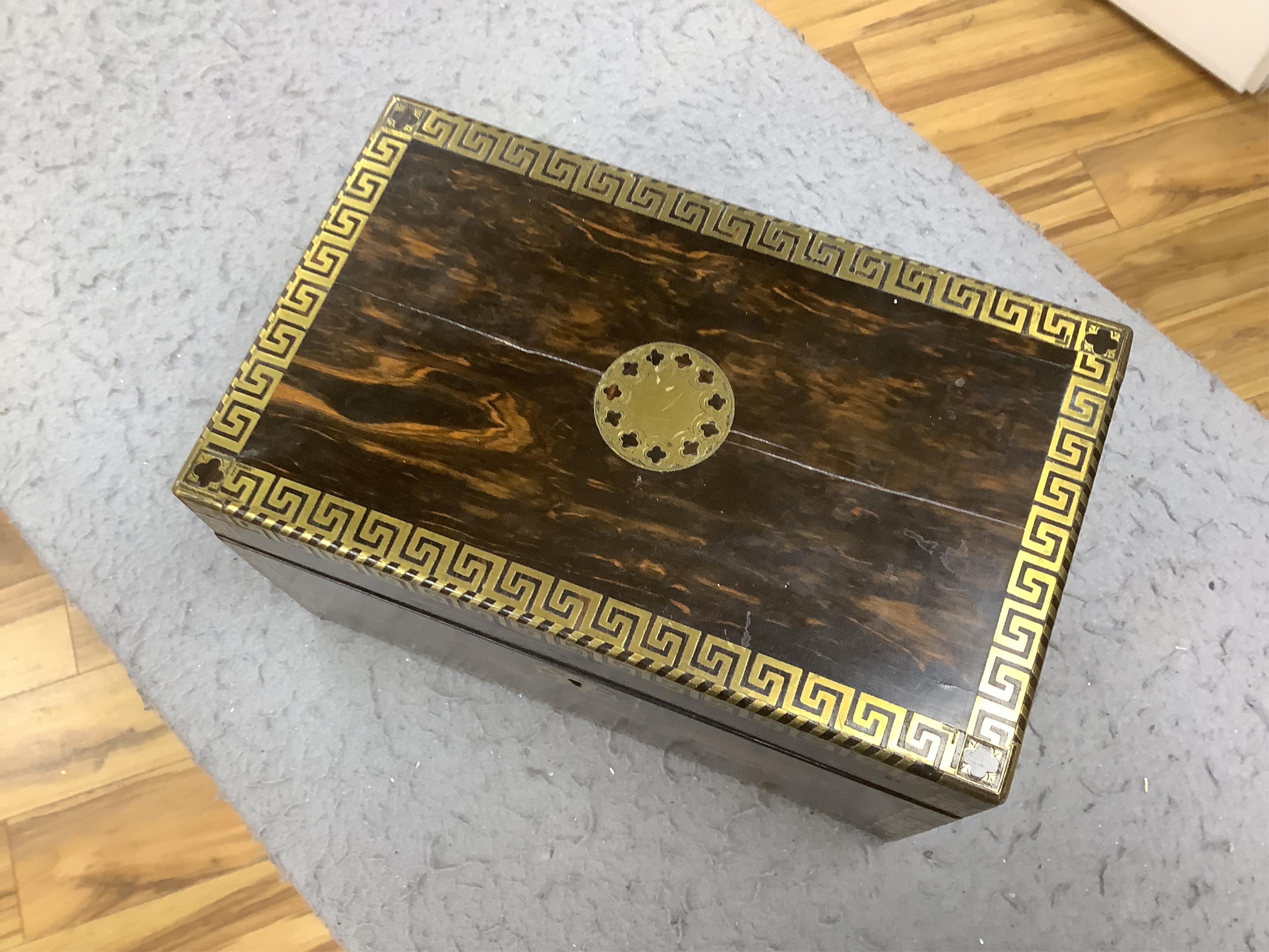 An early 19th century brass inlaid coromandel tea caddy with birch lining, 25cm wide. Condition - fair